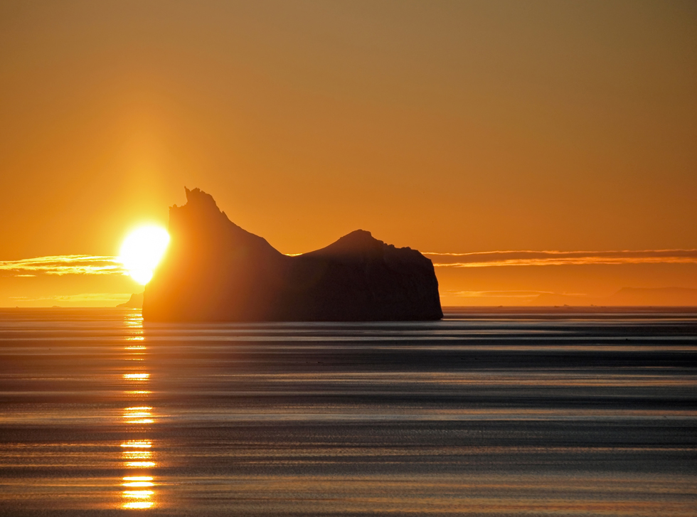 Iceberg in sunset