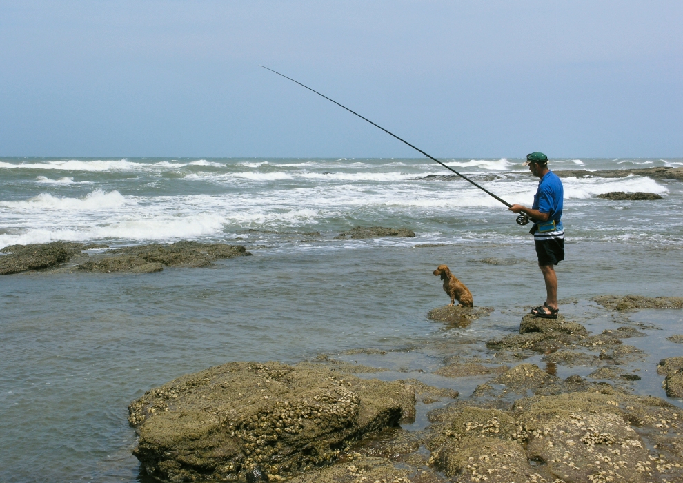 SA fisherman and his dog