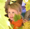 Livvy in Leaves by Glenn Higgs