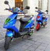 Colourfull Scooters by John Larkin