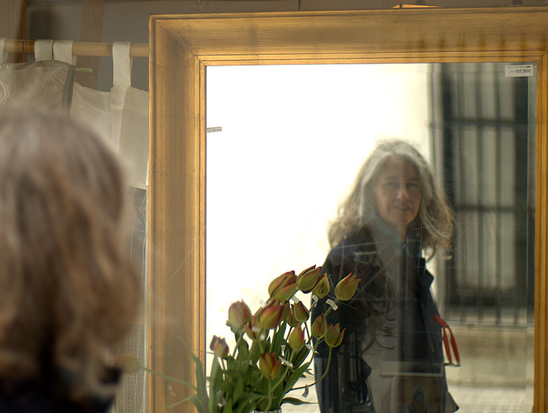 Mirrored portrait with flowers