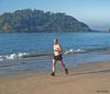 A lone early morning jogger at the beach